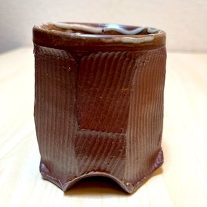 Ceramic Cup. Footed, Faceted, lined & salt fired. Browns. Second.